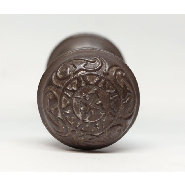 These Vernacular style four fold door knobs were made by Penn in the 1895 catalog. It is part of the H-26700 Magnolia...