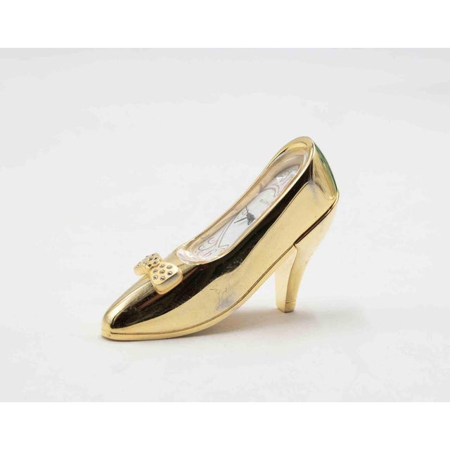 Shoe-Clock realized by Bucherer in 1970s. Metal and Glass.