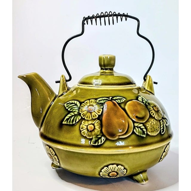This sweetheart is pure 70s kitsch. The avocado green is the perfect backdrop to a period display of sculpted fruits and...