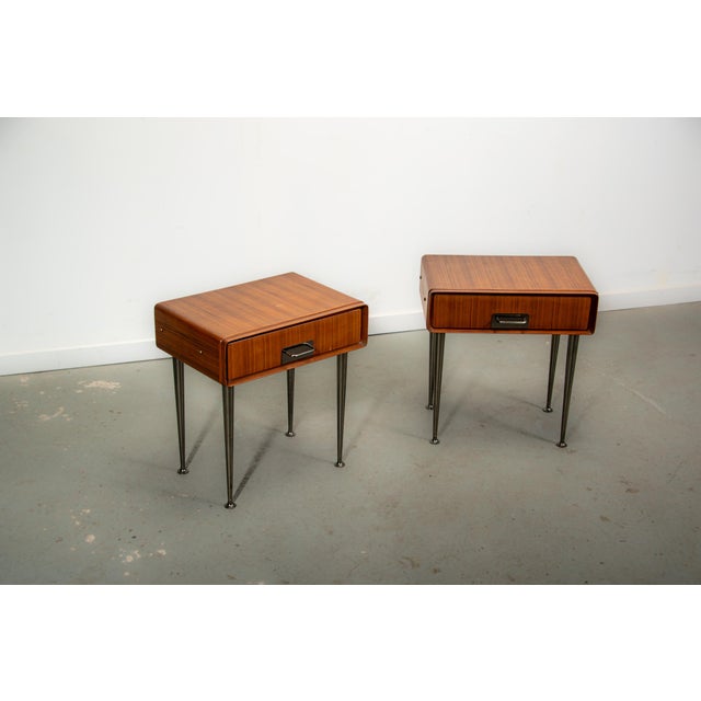 Set of nightstands made in Italy in the 1970s. The nightstands are made from teak with a naturally curved design and...