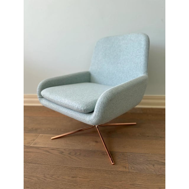 Exceptional Danish design swivel chair in pastel blue. Sophisticated and modern design for any home. Beautiful, sleek,...