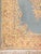 Hand-woven wool and cotton soft blue Persian Kirman rug with central medallion.