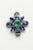 A pair of stunning flower-motif stud earrings featuring a center faceted, oval emerald totaling 1.53 carats and surrounded...