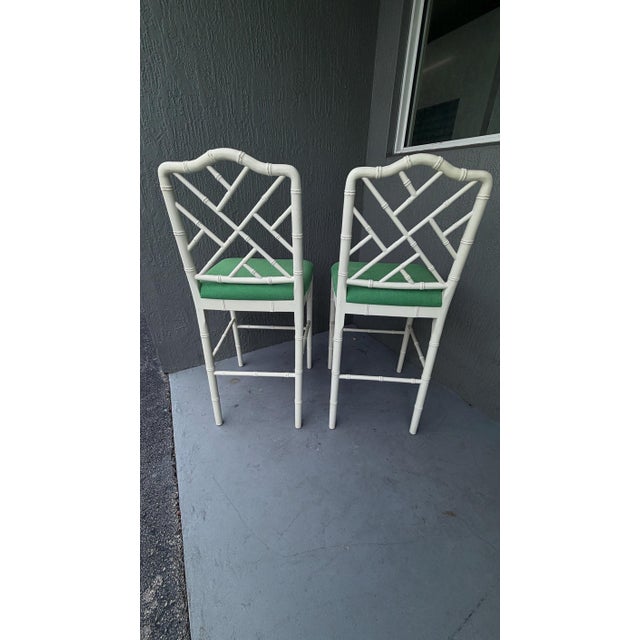 This is a pretty pair of wood barstools by Ballard. The paint is true white. The stools are labelled. These are done in...