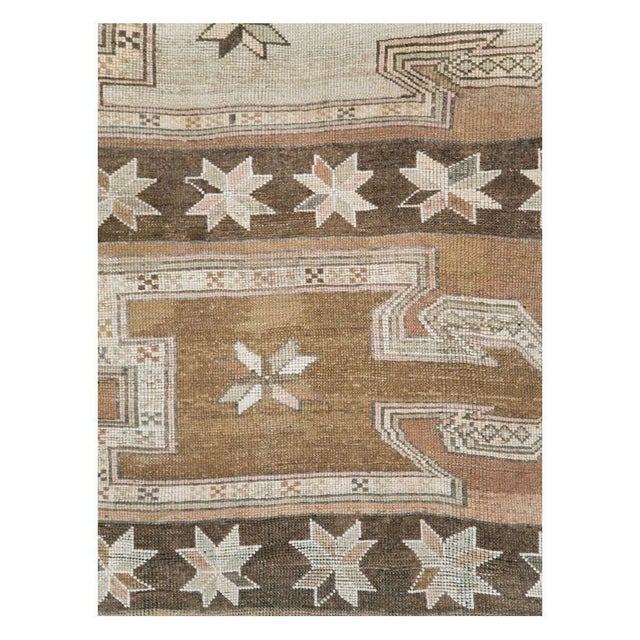A vintage Turkish Anatolian tribal gallery rug handmade during the mid-20th century. Measures: 5' 3" x 10' 3".