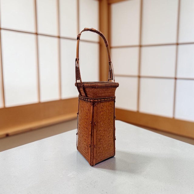 This is a majestic tall Japanese flower-arranging basket (hanakago). It stands as a superlative example of late 20th-...