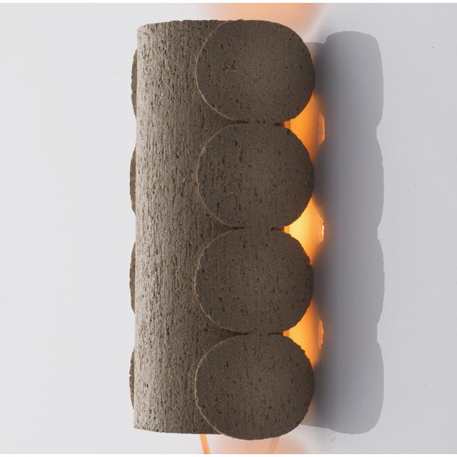 This handcrafted wall light by katia langeard strikes a perfect balance between simplicity and rugged charm, celebrating...