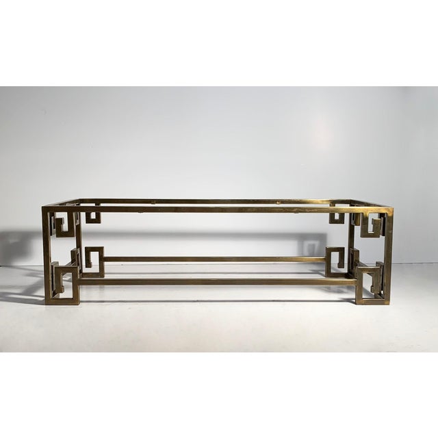 Mastercraft Greek key coffee table brass with glass top insert. The brass finish shows a fair amount of age along with...