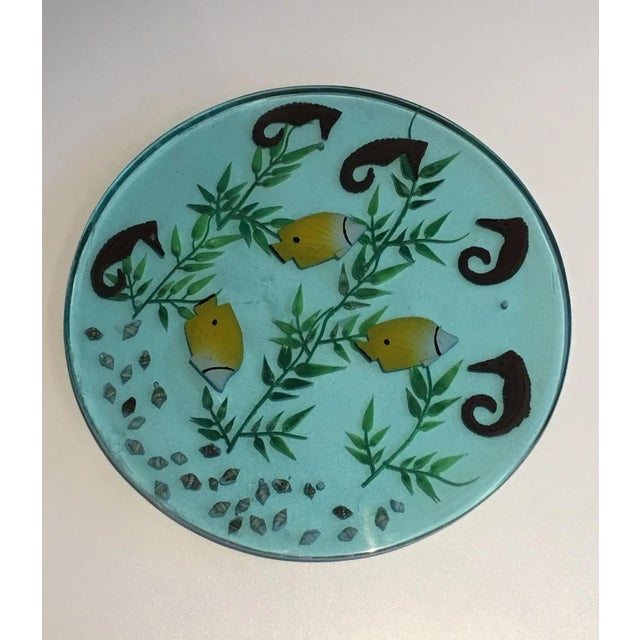 These 4 plates are made of lucite with incrusted seahorses, fishes, algues and shells. This is a French work. Circa 1970.