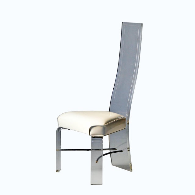 Set of eight vintage lucite dining chairs with off white patent leather seats and chrome supports. Circa 1970. Attributed...