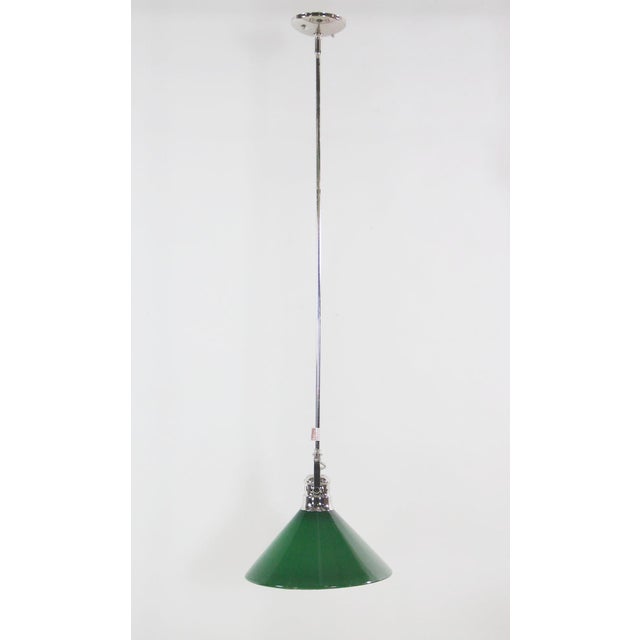 Polished nickel pole pendant light with original antique green glass from Austria. This light has a swivel head that...
