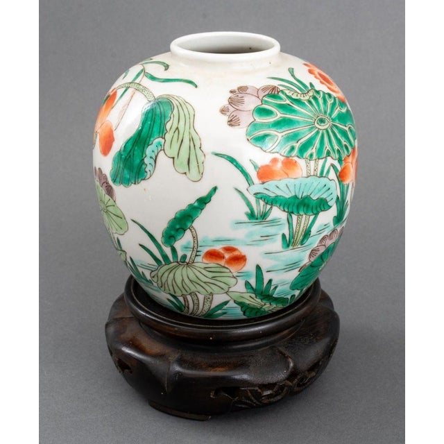 Chinese Famille Verte Glazed Porcelain Vase, globular form hand-painted with lotus flower motif, together with carved wood...