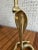 A vintage brass cobra-form candleholder with hand done detailing. Candleholder is mad up of two pieces- top portion screw...