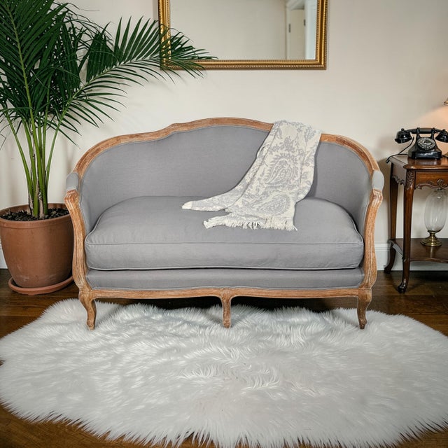 Louis XV style French Rococo settee produced by Ballard Designs, known for European-inspired furniture designed for...