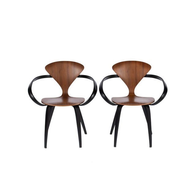 Set of four Norman Cherner armchairs. Produced in 2003, good condition with wear consistent with age. Timeless design,...