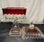 Westmorland ruby red or "ruby flash" candy dish or compote. The vintage glassware piece features a clear glass base and...