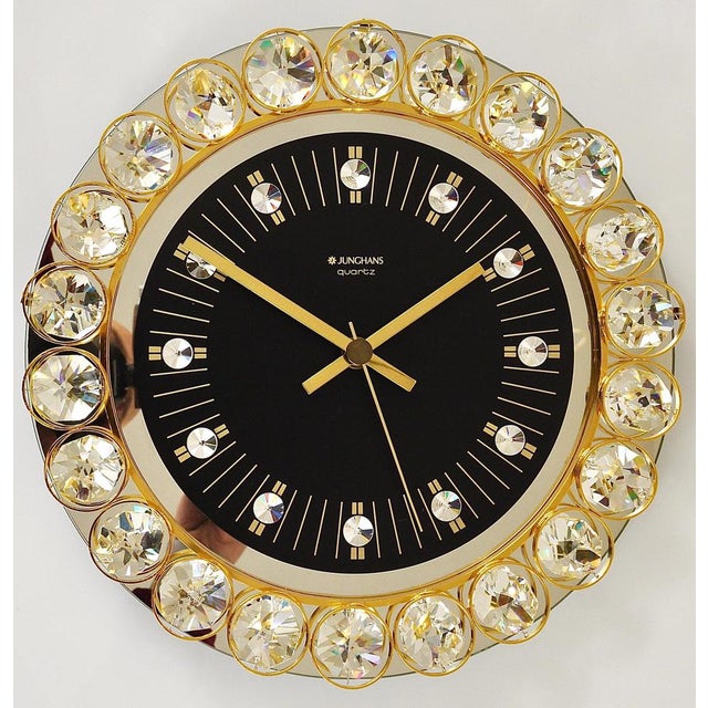 A beautiful round wall clock, executed in the 1970s by Junghans, Germany, in the style of Gaetano Sciolari or Palwa. The...