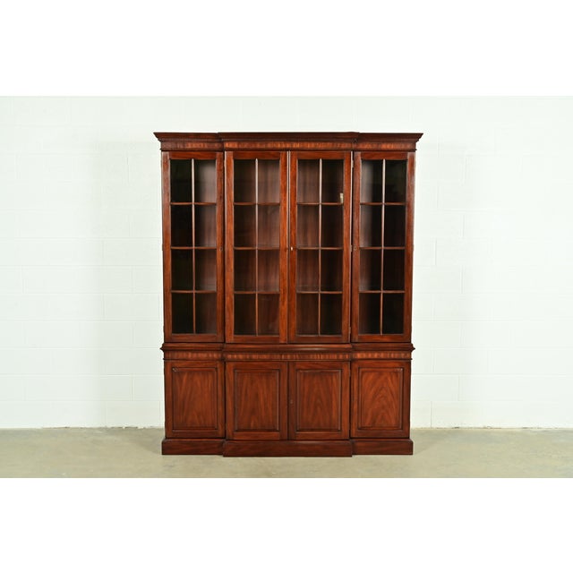 A gorgeous Georgian or Chippendale style lighted breakfront bookcase or dining cabinet By Henkel Harris USA, 1993...