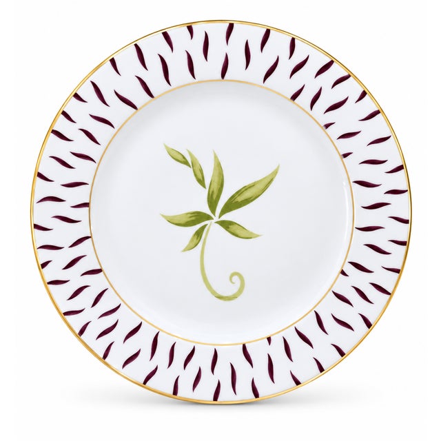 A refined set of eight Bernardaud Frivole Limoges porcelain charger plates, made in France and finished with a graceful...