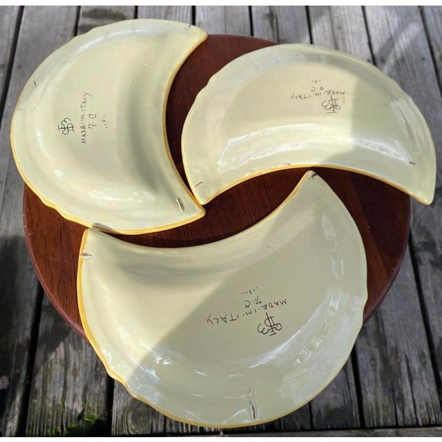 This trio of plates bear a marking from a studio which I have yet to identify, but show all the signs of a genuine set...