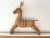 Large three dimensional 1970s wicker reindeer handmade in Hong Kong featuring black striped accents, red eyes, uplifted...