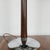 An art deco dome lamp with a mottled brown bakelite stem over a circualr chrome metal base. Chromed metal mushroom shade...