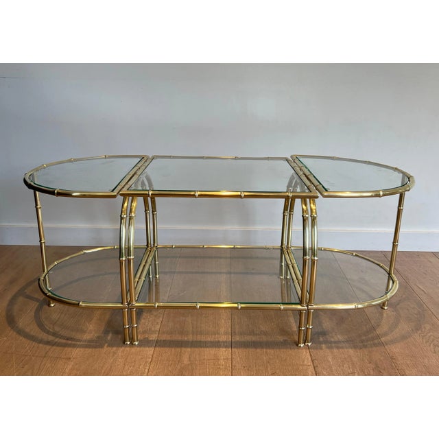 This beautiful and very elegant The Tripartite Coffee Table is made of faux-bamboo style brass with two-tier glass tops....