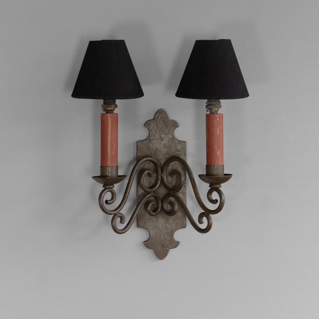 Twin arm wall sconce with original faux candles in original paint finish. Shades not included. Circa 1920. Up to 250V...