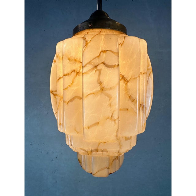 Beautiful Art Deco skyscraper. Beige opaline with amber flames. Brass fixture. Bakelite E27 socket. Rewired. Globe...