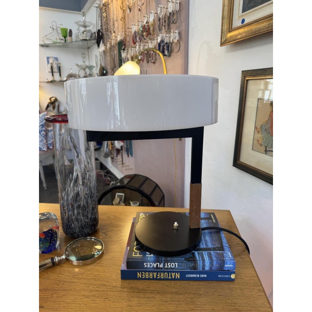 Table lamp, factory design by J. T. Kalmar, Vienna 1962 Shaft and base in lacquered metal with leather handle, cylindrical...