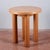 Solid round coffee table italia 1980 made of light veneered wood with solid turned stems. Measures 70 x h 77 category...