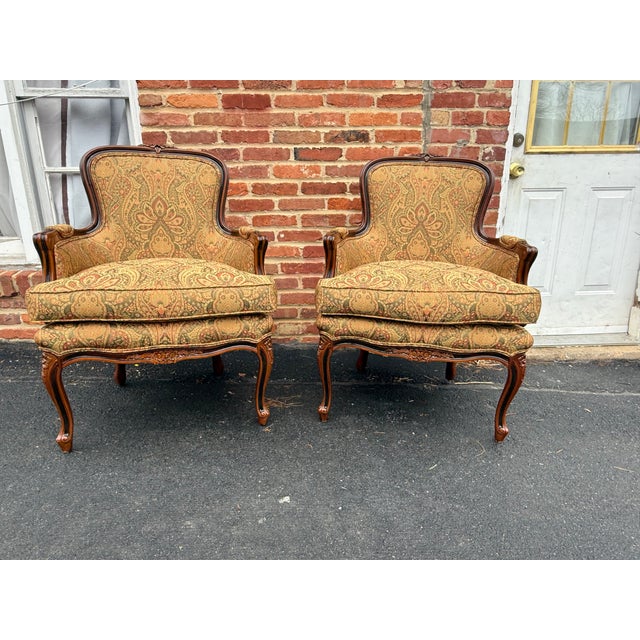 Solid wood frame, curves, scrolled arms, and cabriole legs typical of the Louis XV . The frames are decorated with subtle...