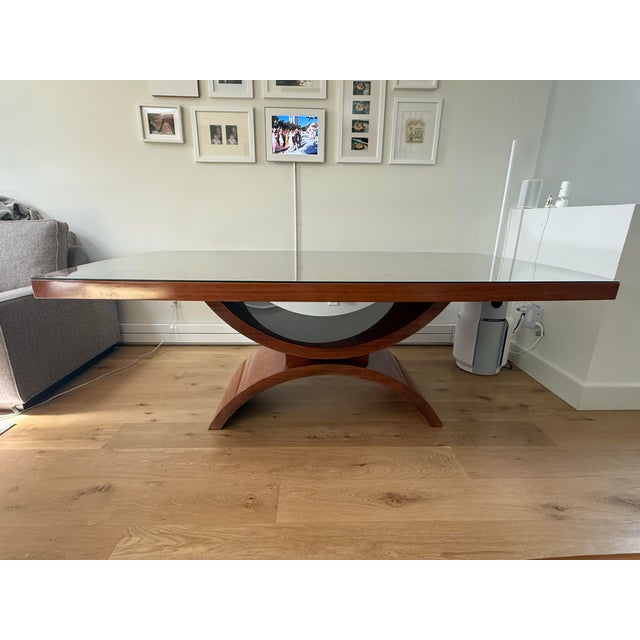 Sculptural, extendable wooden dining table attributed to Italian craftsman P. Costantini originally purchased secondhand...