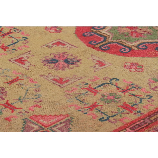 Hand-knotted in wool and originating in East Turkestan circa 1930-50, this 5x8 Vintage Samarkand Rug is among the most...