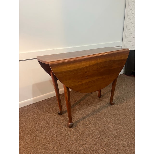 This is a beautiful drop leaf cherry table with gate legs and pad footed. This is a perfect addition for a smaller dining...