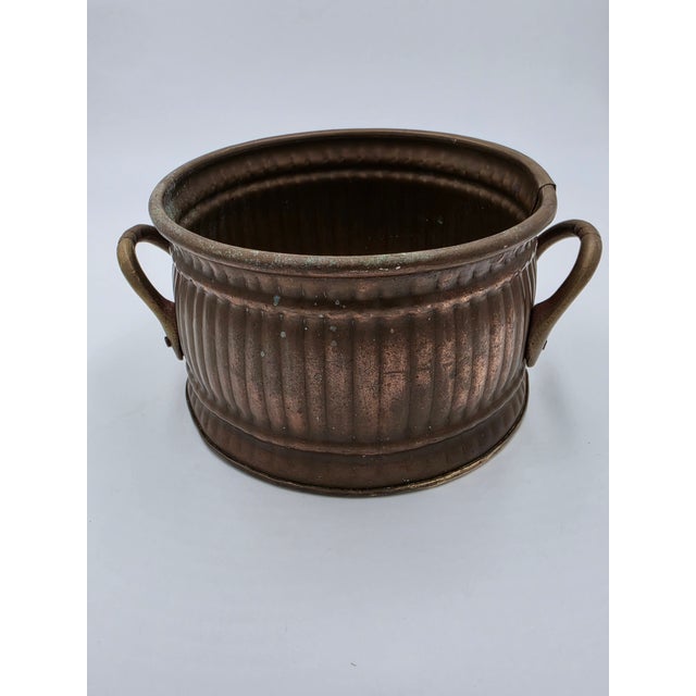 Add warm metallic texture and timeless French country charm to your tabletop or shelf display with this vintage fluted...