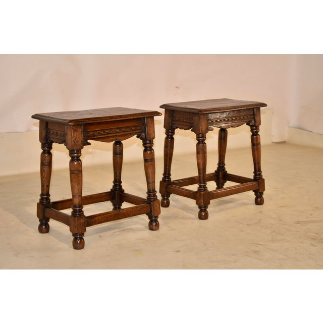 Pair of 19th century elm joint stools from England. This is a lovely pair of 19th century elm joint stools with single...