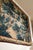 A massive handwoven verdure in the full 17th c. manner: a wooded river landscape with broad-leaved plants across the...