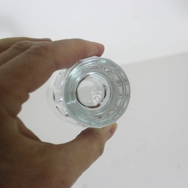 Fantastic vintage glass jigger that has red lines for 1 oz, 1 1/4 oz, 1 1/12 oz. The number markings and lines are clear....