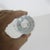 Fantastic vintage glass jigger that has red lines for 1 oz, 1 1/4 oz, 1 1/12 oz. The number markings and lines are clear....