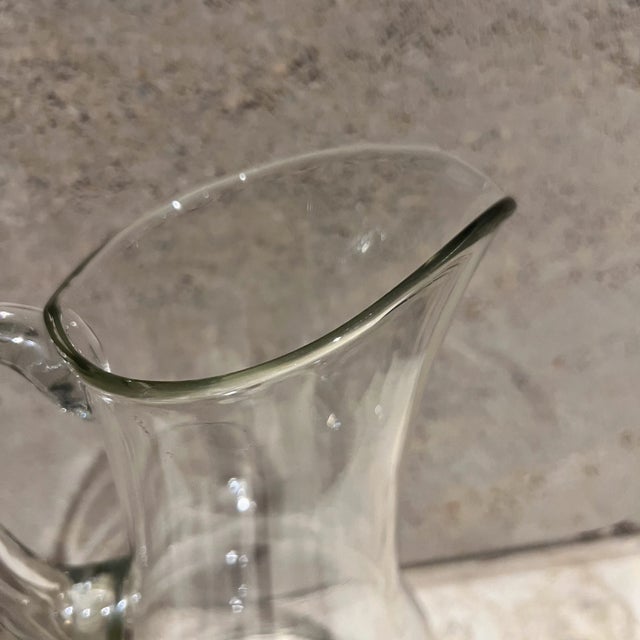 AMBIANIC presents 1970s Glass Drink Pitcher modern lines 11.5 h x 6.75 diameter x 6.75d Preowned vintage Refer to images...