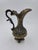 This vintage ornate Italian brass ewer features classic Rococo-inspired craftsmanship. Designed with a high-sweeping...