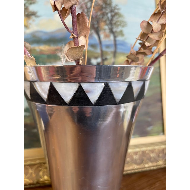 Vintage metal vase by Towle Silversmiths, marked on the underside "Towle Silversmiths Since 1690." The vase features a...