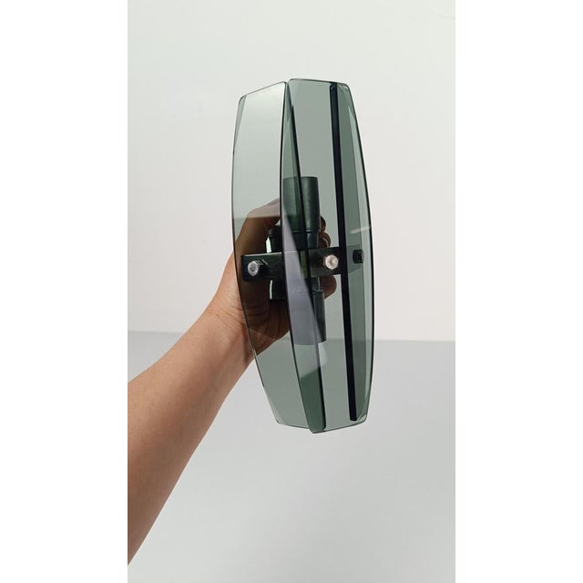 A beautiful pair of blue glass blades wall sconces styled after Fontana Arte. Made in Italy between the 60s and 70s, each...