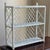 A charming vintage wicker wall shelf featuring an airy lattice design and crisp white-painted finish. Handcrafted from...