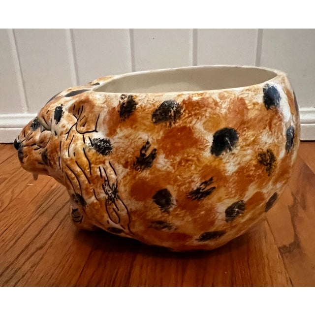 Fabulous Hollywood Regency style cheetah head cachepot / planter. Features a fierce cheetah face on the front with a...