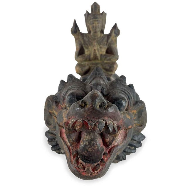 Sculpture of a Fantastic Animal with a Deity, carved from a single piece of exotic wood with traces of polychromy,...