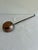 An antique copper ladle with a beautifully dimpled, hand-hammered bowl and rich aged patina, joined to a long forged iron...