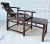 Here is an extremely rare and exceptional Asian Ming chair that has hand carved wood details and a fantastic lounging...