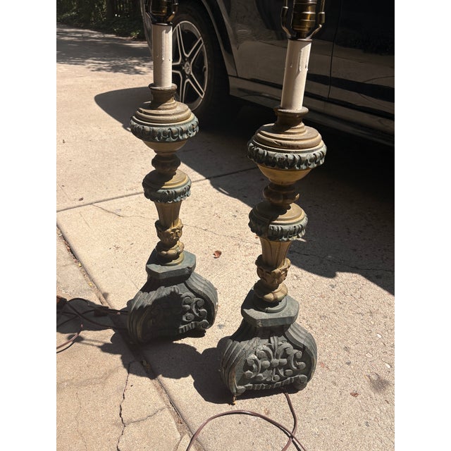 Pair of antique carved and painted wooden lamp bases in green and yellow.